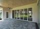 Covered patio with paver stone floor and view of golf course at 7578 Nw 33Rd Pl, Ocala, FL 34482