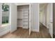 Walk-in closet with custom shelving and hanging rods at 7578 Nw 33Rd Pl, Ocala, FL 34482