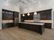 Gourmet kitchen with dark cabinetry and large island at 7578 Nw 33Rd Pl, Ocala, FL 34482