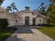 Beautiful house exterior with a paved driveway at 7578 Nw 33Rd Pl, Ocala, FL 34482