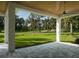 Covered patio with golf course view and ceiling fan at 7578 Nw 33Rd Pl, Ocala, FL 34482