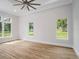 Spacious bedroom with hardwood floors and large windows offering natural light at 7578 Nw 33Rd Pl, Ocala, FL 34482
