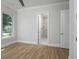 Bright bedroom with hardwood floors and access to bathroom at 7578 Nw 33Rd Pl, Ocala, FL 34482