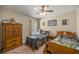 Bedroom with twin beds, wood dresser and window at 3967 Se 99Th St, Belleview, FL 34420