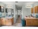 Double vanity bathroom with access to bedroom at 3967 Se 99Th St, Belleview, FL 34420