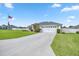 One story home with a two car garage and manicured lawn at 3967 Se 99Th St, Belleview, FL 34420