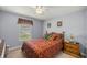 Bedroom with a queen bed and ceiling fan at 3967 Se 99Th St, Belleview, FL 34420
