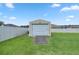 Detached storage shed with roll-up door, ideal for extra storage at 3967 Se 99Th St, Belleview, FL 34420