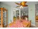 Dining room with a wooden table and view into living room at 3967 Se 99Th St, Belleview, FL 34420