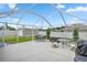 Spacious backyard patio with seating area and a view of the garden at 3967 Se 99Th St, Belleview, FL 34420