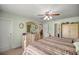 Spacious main bedroom with dresser and view into another room at 3967 Se 99Th St, Belleview, FL 34420