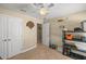 Bedroom with double doors and ceiling fan at 3967 Se 99Th St, Belleview, FL 34420