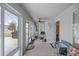 Covered porch with access to backyard and additional seating at 3967 Se 99Th St, Belleview, FL 34420