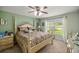 Main bedroom with a large bed and plenty of natural light at 3967 Se 99Th St, Belleview, FL 34420
