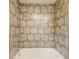 Shower/tub combo with neutral tone tile surround at 9150 Se 49Th Court Rd, Ocala, FL 34480