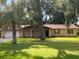 Brick ranch home with mature landscaping and trees at 2710 Sw 36Th Dr, Ocala, FL 34474