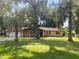 Brick ranch home with mature landscaping and trees at 2710 Sw 36Th Dr, Ocala, FL 34474