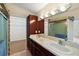 Double vanity bathroom with walk-in shower and separate closet at 10 Se Chinica Drive, Summerfield, FL 34491