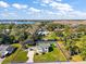 Aerial view showcasing home's curb appeal and waterfront lot at 10 Se Chinica Drive, Summerfield, FL 34491