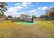 Backyard with storage shed and artificial turf at 10 Se Chinica Drive, Summerfield, FL 34491