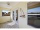 Covered porch with french doors and nautical decor at 10 Se Chinica Drive, Summerfield, FL 34491