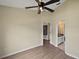 Spacious bedroom with ceiling fan and en-suite bathroom access at 10 Se Chinica Drive, Summerfield, FL 34491
