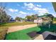 Large backyard with covered patio, shed, and spacious grassy area at 10 Se Chinica Drive, Summerfield, FL 34491
