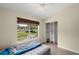 Bedroom with large window, walk-in closet, and vinyl plank flooring at 10 Se Chinica Drive, Summerfield, FL 34491