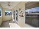 Covered porch with french doors and nautical decor at 10 Se Chinica Drive, Summerfield, FL 34491