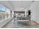Dining area with table and bench seating near the kitchen at 1789 Usrey Ct, The Villages, FL 34762