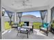 Relaxing screened porch with wicker furniture and backyard view at 1789 Usrey Ct, The Villages, FL 34762
