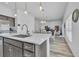 Modern kitchen island with white countertops and gray cabinets at 1789 Usrey Ct, The Villages, FL 34762