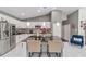 Modern kitchen with island and white cabinetry at 14550 Sw 61St Ct, Ocala, FL 34473