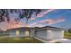 Newly constructed home with gray siding, two-car garage, and landscaped yard at 9731 Bahia Rd, Ocala, FL 34472