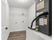Laundry room with vinyl plank flooring and shelving at 7128 Sw 134Th St, Ocala, FL 34473