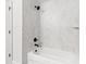 Bathroom with marble-tiled shower/tub combo at 7128 Sw 134Th St, Ocala, FL 34473