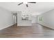 Open living room with vinyl plank flooring and kitchen island view at 7128 Sw 134Th St, Ocala, FL 34473