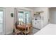 White kitchen cabinets, hexagon backsplash and a breakfast nook at 25 Nw 45Th Loop, Ocala, FL 34475