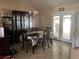 Dining room with a table and hutch, near sliding doors at 6690 Cherry Rd, Ocala, FL 34472