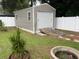 Exterior shed with roll-up door and ramp at 6690 Cherry Rd, Ocala, FL 34472