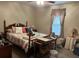 Bedroom with a double bed, side table, and window at 6690 Cherry Rd, Ocala, FL 34472