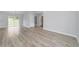 Bright and airy living area featuring wood-look floors and a view to backyard at 13625 Sw 107 Pl, Dunnellon, FL 34432