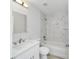 Bathroom with marble shower/tub combo and modern vanity at 13625 Sw 107 Pl, Dunnellon, FL 34432