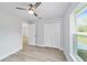 Spacious bedroom with double-door closet and wood-look floors at 13625 Sw 107 Pl, Dunnellon, FL 34432