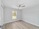 Bright bedroom with ceiling fan and wood-look floors at 13625 Sw 107 Pl, Dunnellon, FL 34432