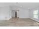 Main bedroom with gray walls, vinyl flooring, and access to bathroom at 13625 Sw 107 Pl, Dunnellon, FL 34432