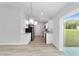 Open concept kitchen with stainless steel appliances and view to backyard at 13625 Sw 107 Pl, Dunnellon, FL 34432
