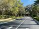 Road and landscaping leading to community entrance at 7088 Sw 179Th Court Rd, Dunnellon, FL 34432