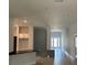 Open concept living room and hallway with tile floors at 7088 Sw 179Th Court Rd, Dunnellon, FL 34432