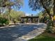 Gated entrance to Juliette Falls community with lush landscaping at 7088 Sw 179Th Court Rd, Dunnellon, FL 34432